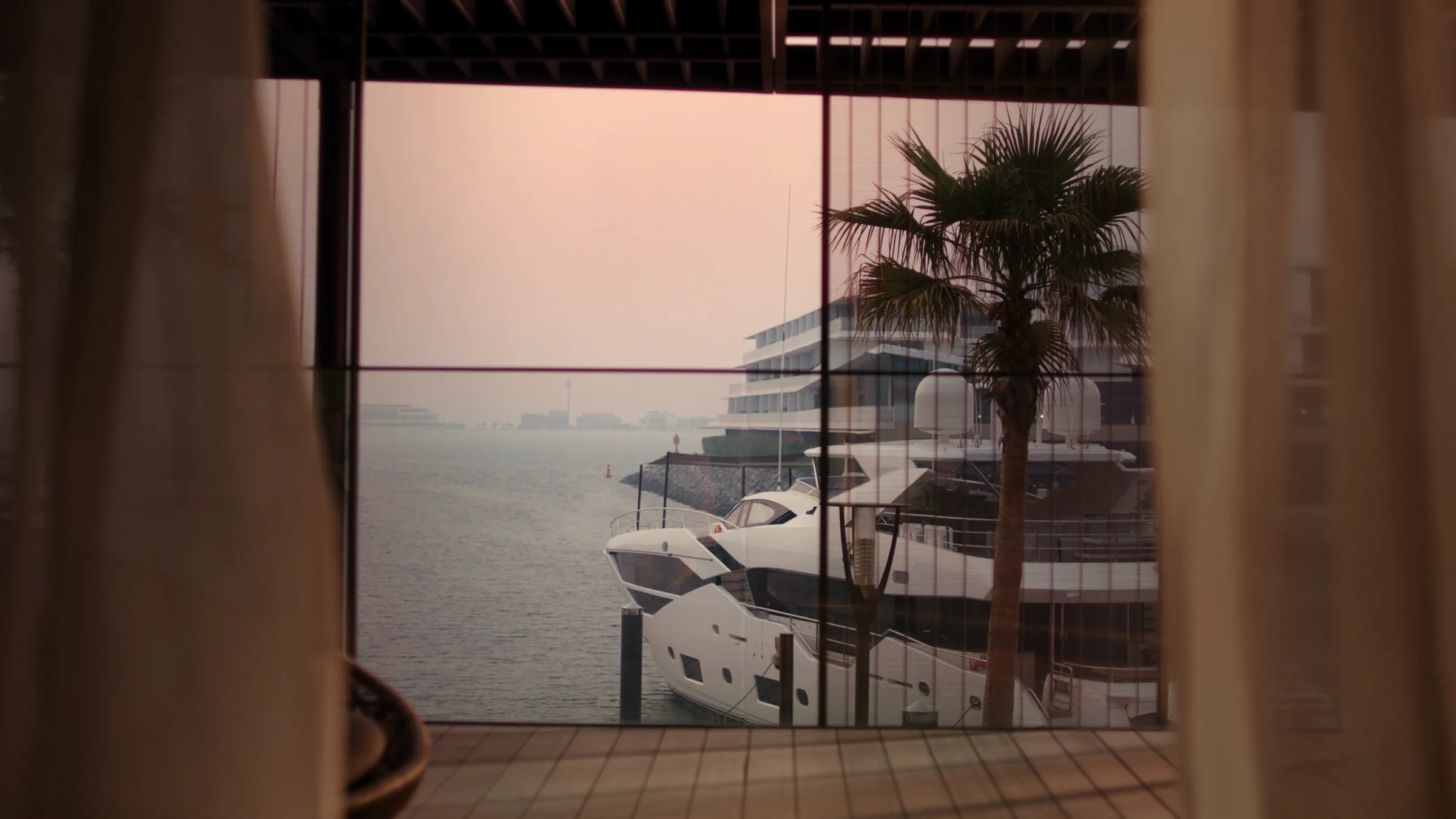 Floor-to-ceiling windows onto the marina
